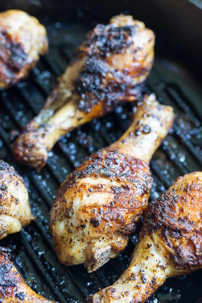 These spicy chicken drumsticks are perfectly seasoned, grilled, and tossed in a spicy, flavor-packed sauce!  Perfect for grilling season (or anytime of year!), family friendly, gluten-free, Paleo and Whole30 compliant. 