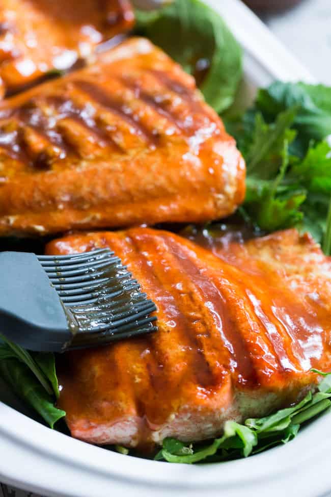 This Paleo and Whole30 Grilled Teriyaki Salmon is incredibly easy and busting out with flavor!  A simple date-sweetened teriyaki sauce is drizzled all over perfectly grilled salmon fillets and topped with toasted sesame seeds and scallions.  Perfect over a green salad or cauliflower rice!