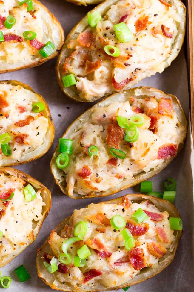 These savory and healthy twice baked potatoes are loaded up with a chicken caesar filling that will have you craving them constantly!  They're dairy-free, paleo, and Whole30 compliant.  Great as a side dish or full meal.  Perfect to prep ahead of time too and easy to reheat! 