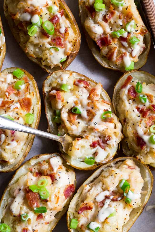 These savory and healthy twice baked potatoes are loaded up with a chicken caesar filling that will have you craving them constantly!  They're dairy-free, paleo, and Whole30 compliant.  Great as a side dish or full meal.  Perfect to prep ahead of time too and easy to reheat! 