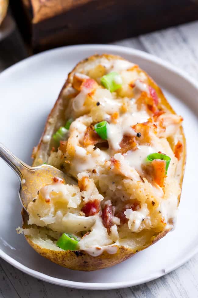 These savory and healthy twice baked potatoes are loaded up with a chicken caesar filling that will have you craving them constantly!  They're dairy-free, paleo, and Whole30 compliant.  Great as a side dish or full meal.  Perfect to prep ahead of time too and easy to reheat! 