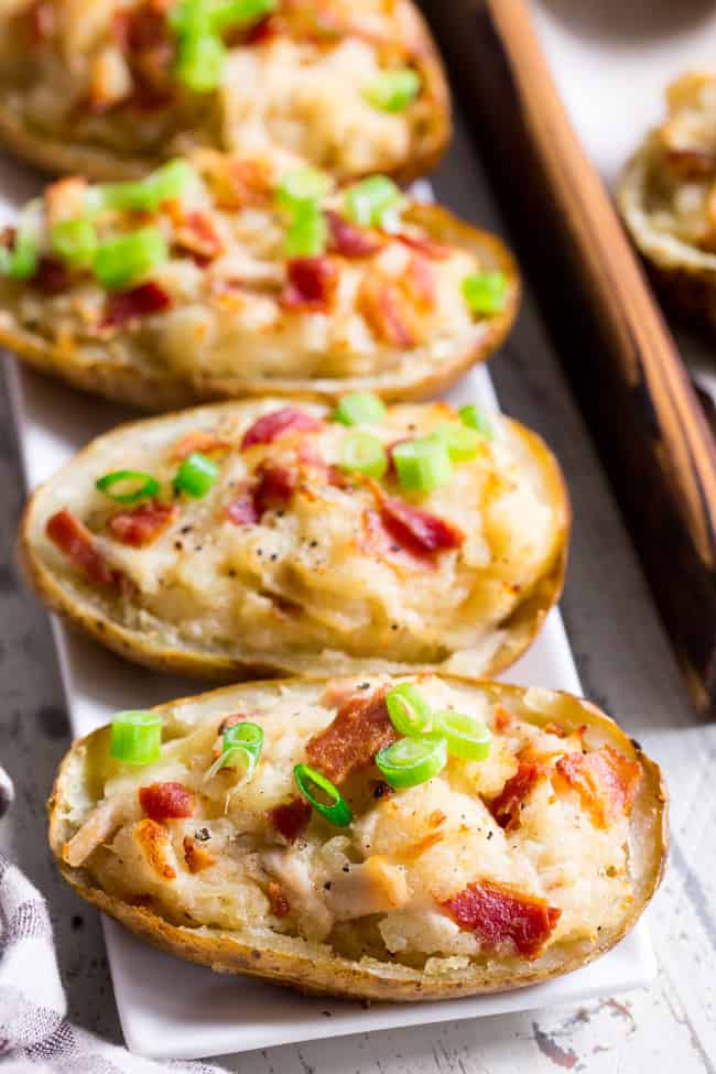 These savory and healthy twice baked potatoes are loaded up with a chicken caesar filling that will have you craving them constantly!  They're dairy-free, paleo, and Whole30 compliant.  Great as a side dish or full meal.  Perfect to prep ahead of time too and easy to reheat! 