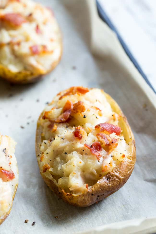 These savory and healthy twice baked potatoes are loaded up with a chicken caesar filling that will have you craving them constantly!  They're dairy-free, paleo, and Whole30 compliant.  Great as a side dish or full meal.  Perfect to prep ahead of time too and easy to reheat! 