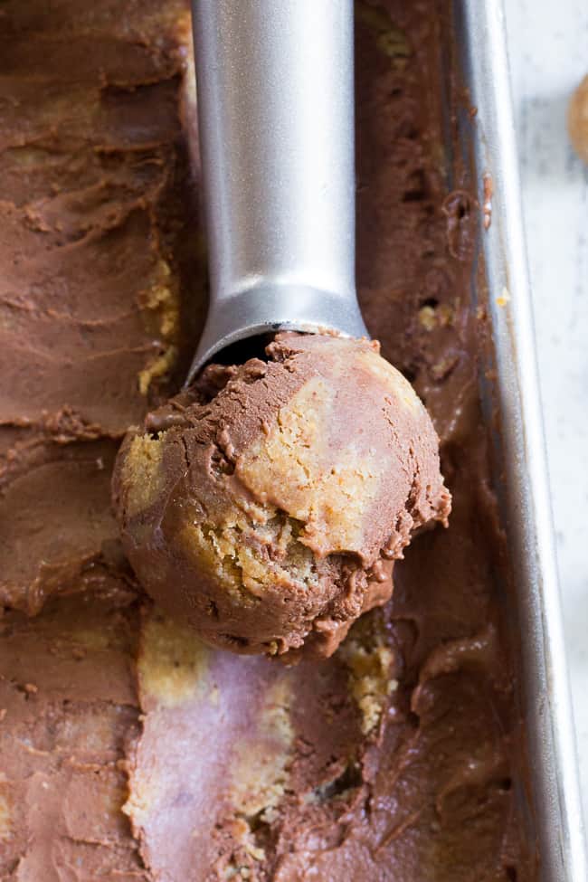 This paleo and vegan chocolate almond butter cookie dough ice cream is rich, creamy and super easy to make!  This no-churn chocolate ice cream is packed with grain free and paleo almond butter cookie dough chunks throughout.  It's family approved and irresistibly chocolatey! 