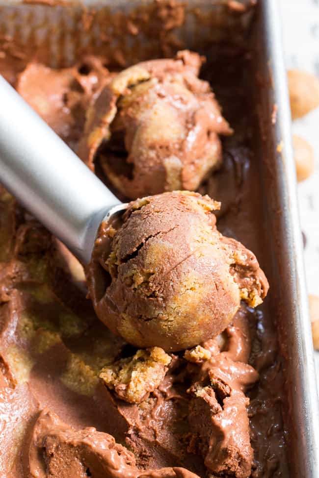 This paleo and vegan chocolate almond butter cookie dough ice cream is rich, creamy and super easy to make!  This no-churn chocolate ice cream is packed with grain free and paleo almond butter cookie dough chunks throughout.  It's family approved and irresistibly chocolatey! 