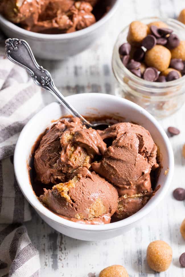 This paleo and vegan chocolate almond butter cookie dough ice cream is rich, creamy and super easy to make!  This no-churn chocolate ice cream is packed with grain free and paleo almond butter cookie dough chunks throughout.  It's family approved and irresistibly chocolatey! 