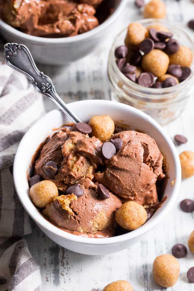 This paleo and vegan chocolate almond butter cookie dough ice cream is rich, creamy and super easy to make!  This no-churn chocolate ice cream is packed with grain free and paleo almond butter cookie dough chunks throughout.  It's family approved and irresistibly chocolatey! 