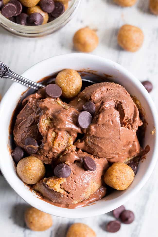 This paleo and vegan chocolate almond butter cookie dough ice cream is rich, creamy and super easy to make!  This no-churn chocolate ice cream is packed with grain free and paleo almond butter cookie dough chunks throughout.  It's family approved and irresistibly chocolatey! 