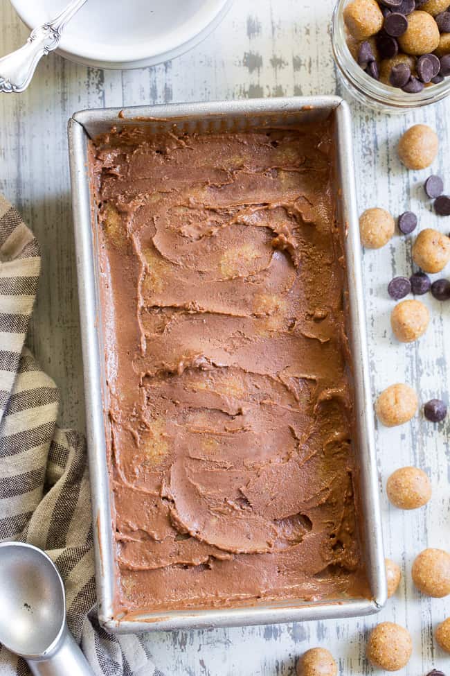 This paleo and vegan chocolate almond butter cookie dough ice cream is rich, creamy and super easy to make!  This no-churn chocolate ice cream is packed with grain free and paleo almond butter cookie dough chunks throughout.  It's family approved and irresistibly chocolatey! 