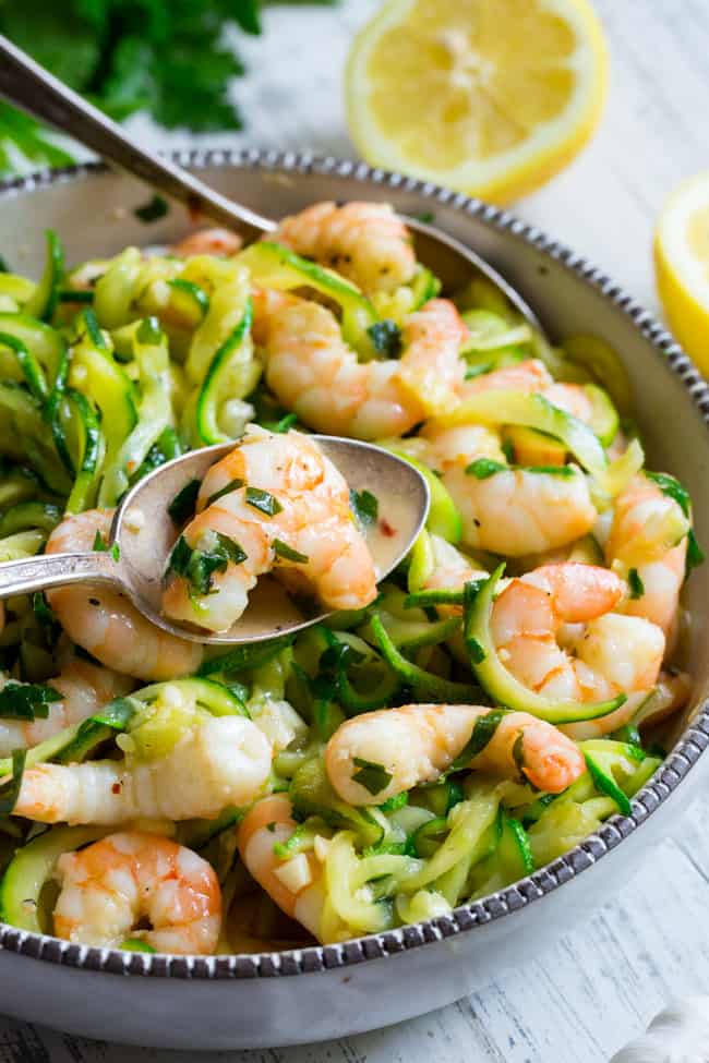 This paleo shrimp scampi is packed with flavor and perfect tossed with zucchini noodles!  Prep your zoodles ahead of time for a quick, easy, and wildly delicious gluten-free, paleo, keto, and Whole30 compliant dinner that's ready in just 20 minutes.