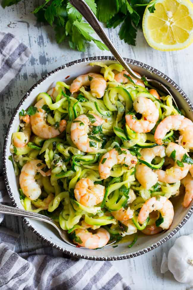 This paleo shrimp scampi is packed with flavor and perfect tossed with zucchini noodles!  Prep your zoodles ahead of time for a quick, easy, and wildly delicious gluten-free, paleo, keto, and Whole30 compliant dinner that's ready in just 20 minutes.