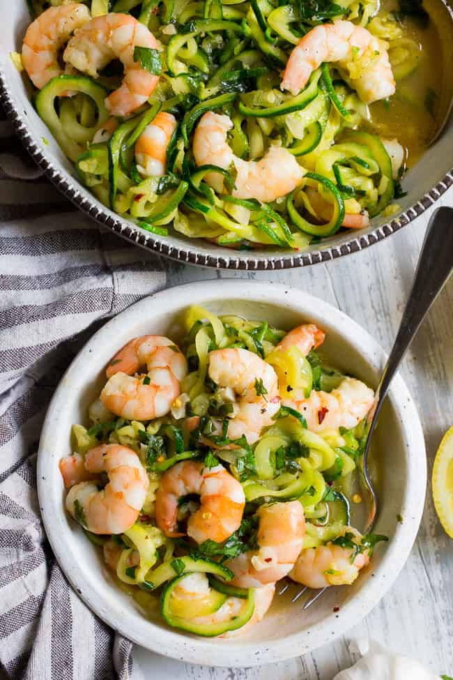 This paleo shrimp scampi is packed with flavor and perfect tossed with zucchini noodles!  Prep your zoodles ahead of time for a quick, easy, and wildly delicious gluten-free, paleo, keto, and Whole30 compliant dinner that's ready in just 20 minutes.