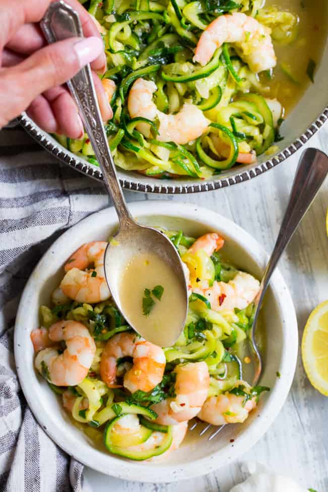 This paleo shrimp scampi is packed with flavor and perfect tossed with zucchini noodles!  Prep your zoodles ahead of time for a quick, easy, and wildly delicious gluten-free, paleo, keto, and Whole30 compliant dinner that's ready in just 20 minutes.