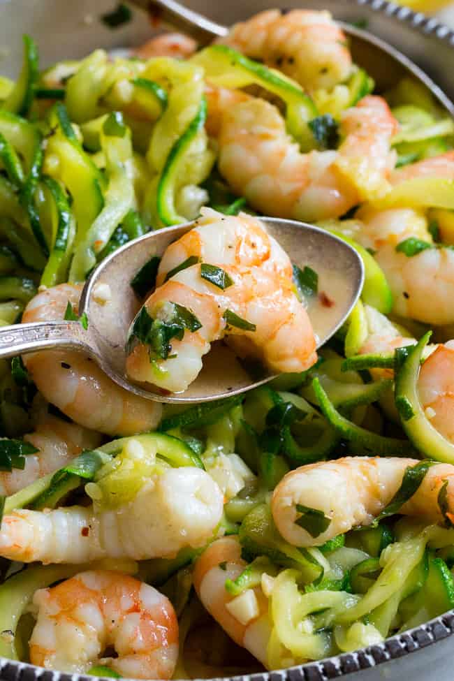 This paleo shrimp scampi is packed with flavor and perfect tossed with zucchini noodles!  Prep your zoodles ahead of time for a quick, easy, and wildly delicious gluten-free, paleo, keto, and Whole30 compliant dinner that's ready in just 20 minutes.