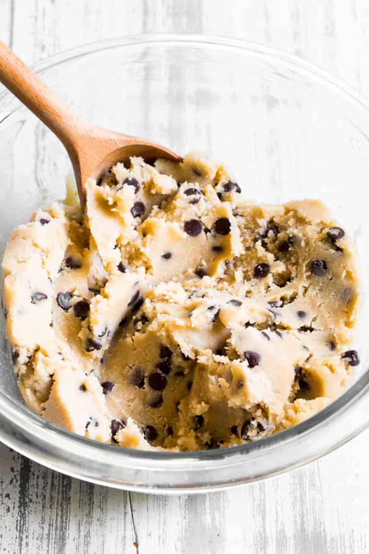 healthy edible cookie dough in mixing bowl with mini chocolate chips