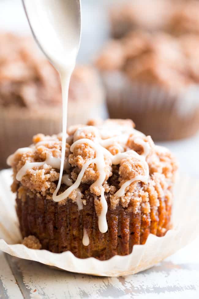 These paleo pumpkin muffins with cinnamon streusel are everything I love about fall baking!  Moist, sweetly spiced pumpkin muffins are topped with the perfect streusel plus an optional maple icing!  They’re a kid favorite and happen to be gluten-free, grain free, and have a tested dairy free option.