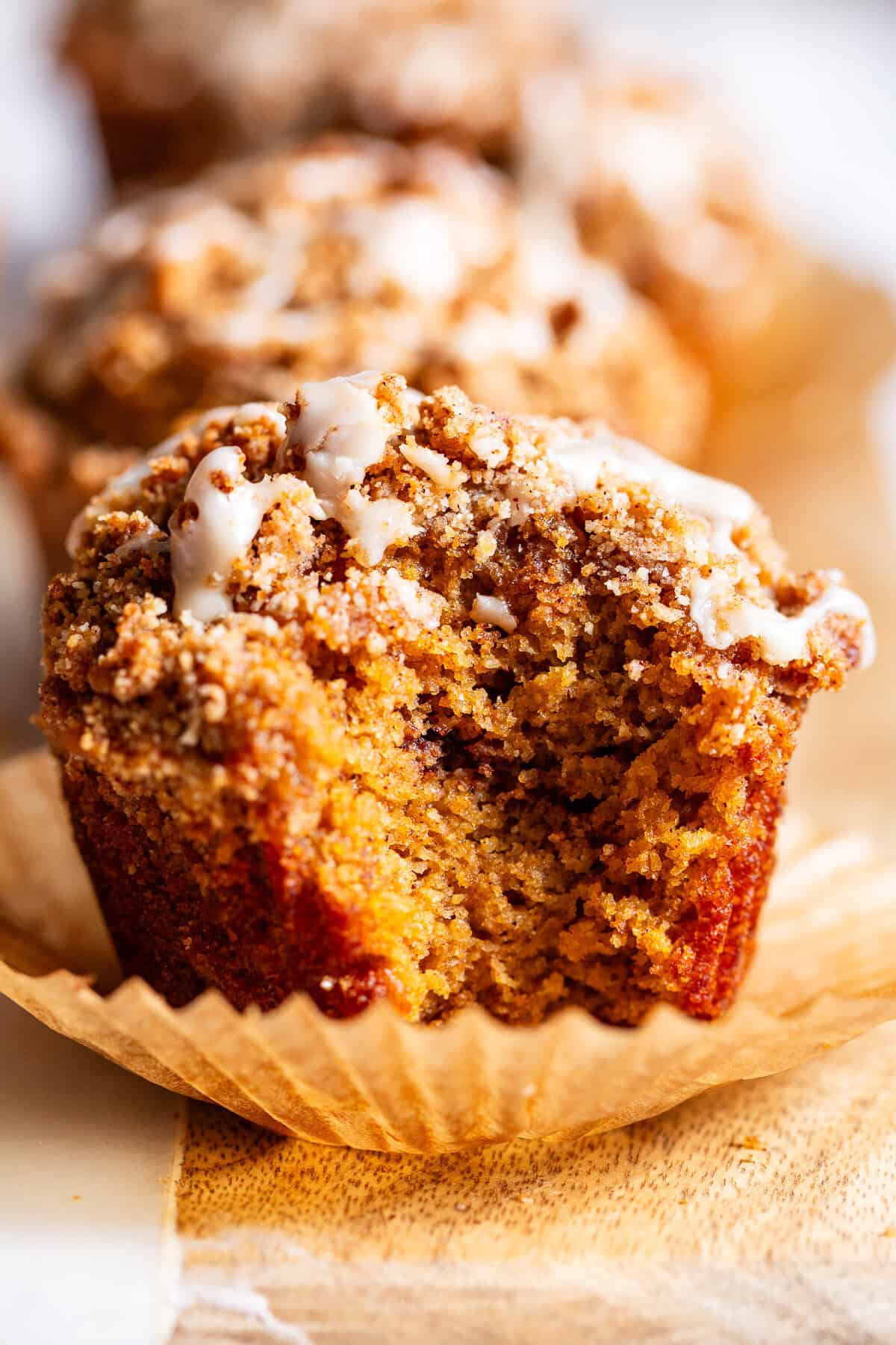 Almond flour pumpkin muffin topped with cinnamon streusel showing crumb texture