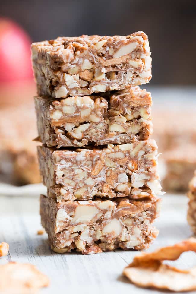 These grain free, vegan, and paleo granola bars are packed with warm spices and chopped dried apples for a fun fall touch!  They're sweetened with pure maple syrup and contain no refined sugar, grains or dairy.  They're chewy, crunchy, family approved and perfect for after school snacks!