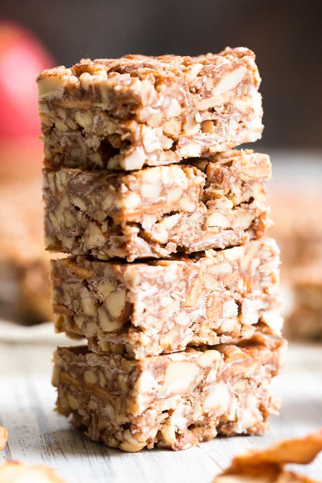 These grain free, vegan, and paleo granola bars are packed with warm spices and chopped dried apples for a fun fall touch!  They're sweetened with pure maple syrup and contain no refined sugar, grains or dairy.  They're chewy, crunchy, family approved and perfect for after school snacks!