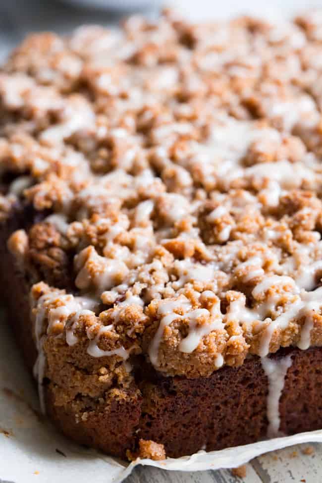 This paleo cinnamon apple coffee cake has it all!  Perfectly moist grain free dairy free coffee cake topped with a layer of homemade apple pie filling and a crumble top.  It's one of my favorites for fall baking and I know you and your family will love it as well!