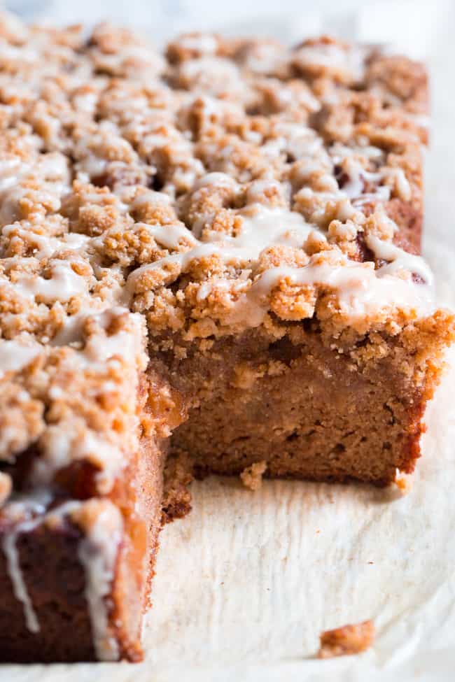 This paleo cinnamon apple coffee cake has it all!  Perfectly moist grain free dairy free coffee cake topped with a layer of homemade apple pie filling and a crumble top.  It's one of my favorites for fall baking and I know you and your family will love it as well!