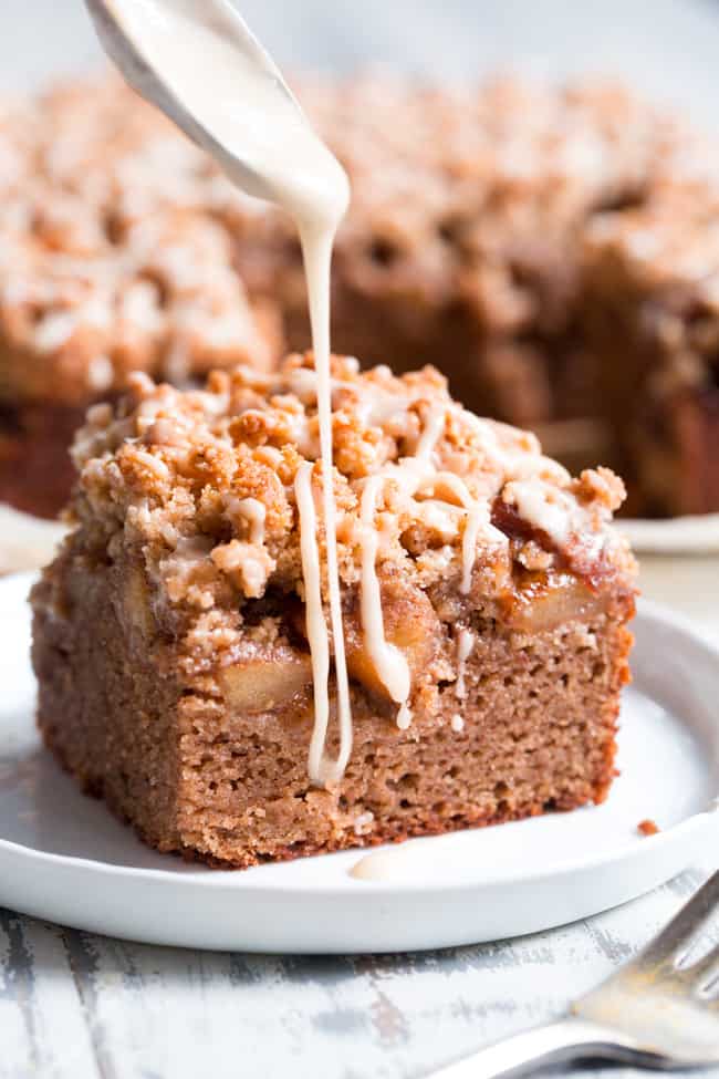 This paleo cinnamon apple coffee cake has it all!  Perfectly moist grain free dairy free coffee cake topped with a layer of homemade apple pie filling and a crumble top.  It's one of my favorites for fall baking and I know you and your family will love it as well!