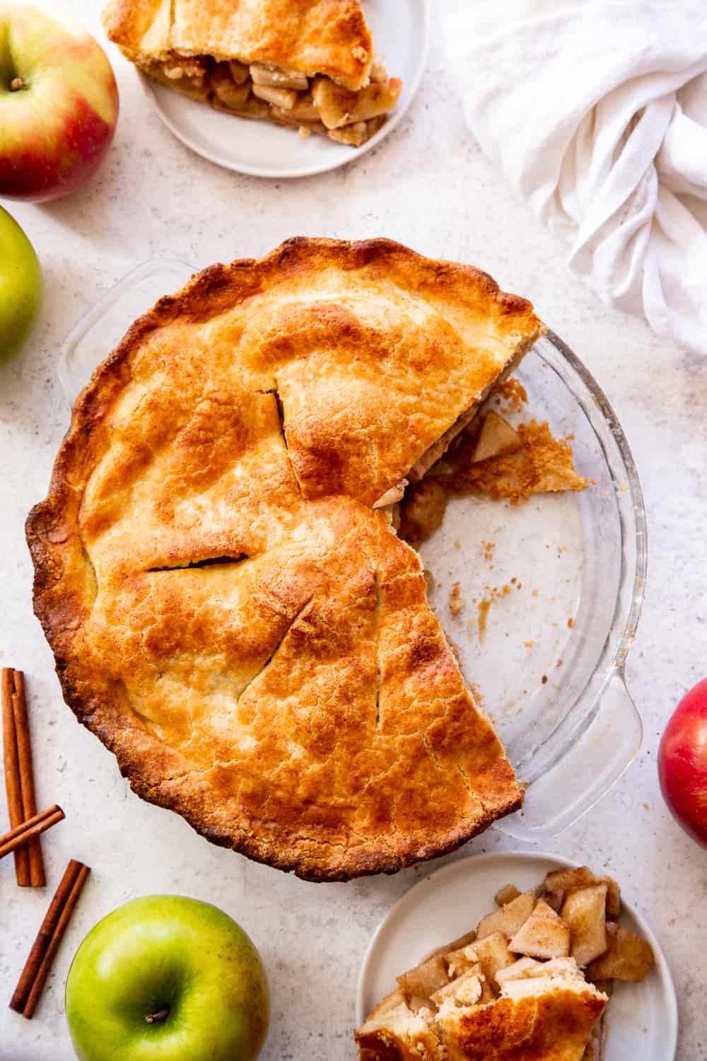 This classic Paleo Apple Pie has an easy double crust made with a dairy free option and is loaded with juicy gooey apples, warm spices and sweetened naturally with pure maple sugar.  It's a family favorite and perfect for Thanksgiving or any special celebration this fall!  #paleo #applepie #glutenfree #apples #cleaneating #paleobaking #glutenfreebaking