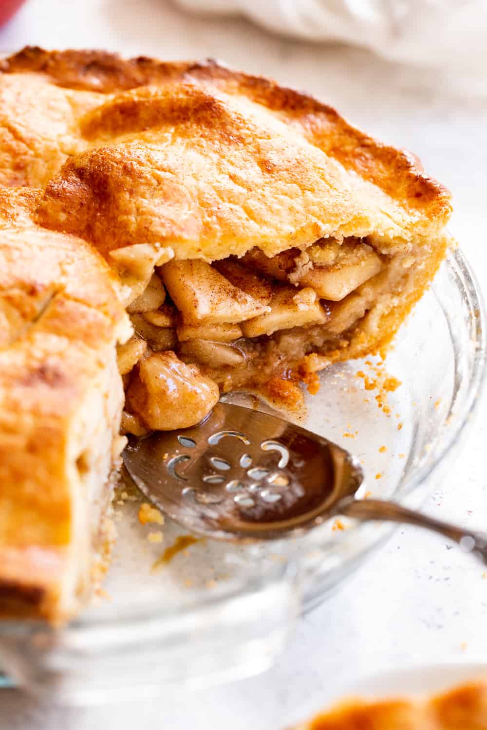 This classic Paleo Apple Pie has an easy double crust made with a dairy free option and is loaded with juicy gooey apples, warm spices and sweetened naturally with pure maple sugar.  It's a family favorite and perfect for Thanksgiving or any special celebration this fall!  #paleo #applepie #glutenfree #apples #cleaneating #paleobaking #glutenfreebaking