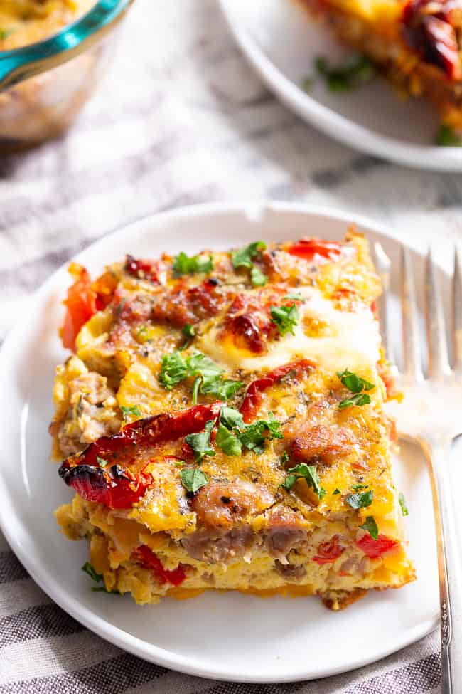 This Italian breakfast casserole is packed with goodies!  Sausage, sun dried tomatoes, peppers, onions, garlic, spices, and a creamy egg mixture!  It's Paleo and Whole30 compliant, great to make ahead, and family approved. 