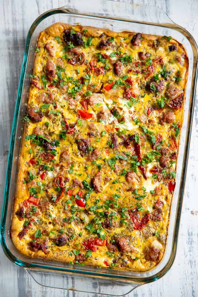 This Italian breakfast casserole is packed with goodies!  Sausage, sun dried tomatoes, peppers, onions, garlic, spices, and a creamy egg mixture!  It's Paleo and Whole30 compliant, great to make ahead, and family approved. 