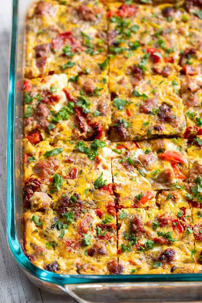 This Italian breakfast casserole is packed with goodies!  Sausage, sun dried tomatoes, peppers, onions, garlic, spices, and a creamy egg mixture!  It's Paleo and Whole30 compliant, great to make ahead, and family approved. 
