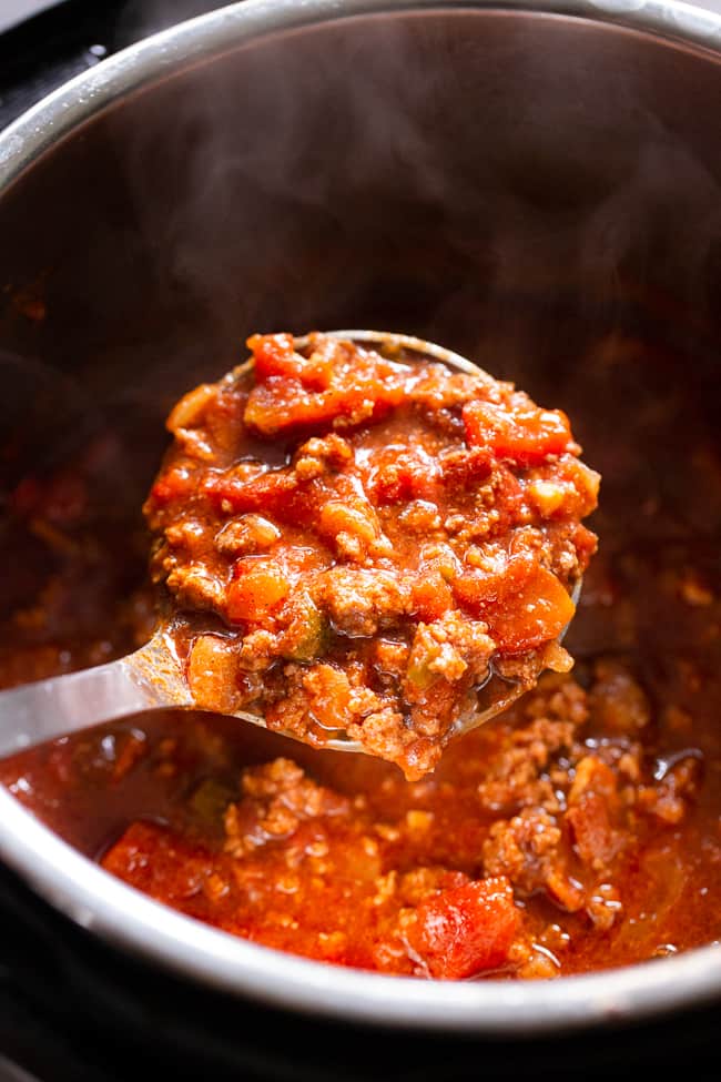 This easy instant pot beef chili is packed with everything you’re craving!  Savory ground beef and bacon, peppers, onions and garlic and the perfect spices.  It’s paleo, dairy-free, Whole30 compliant and keto friendly, delicious and family approved! Paleo dinner. Paleo recipes. Whole30 dinner. Whole30 chili. Keto recipes.