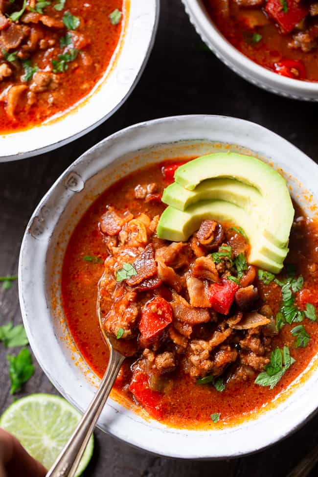 This easy instant pot beef chili is packed with everything you’re craving!  Savory ground beef and bacon, peppers, onions and garlic and the perfect spices.  It’s paleo, dairy-free, Whole30 compliant and keto friendly, delicious and family approved! Paleo dinner. Paleo recipes. Whole30 dinner. Whole30 chili. Keto recipes.
