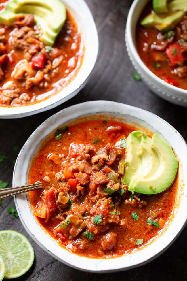 This easy instant pot beef chili is packed with everything you’re craving!  Savory ground beef and bacon, peppers, onions and garlic and the perfect spices.  It’s paleo, dairy-free, Whole30 compliant and keto friendly, delicious and family approved! Paleo dinner. Paleo recipes. Whole30 dinner. Whole30 chili. Keto recipes.