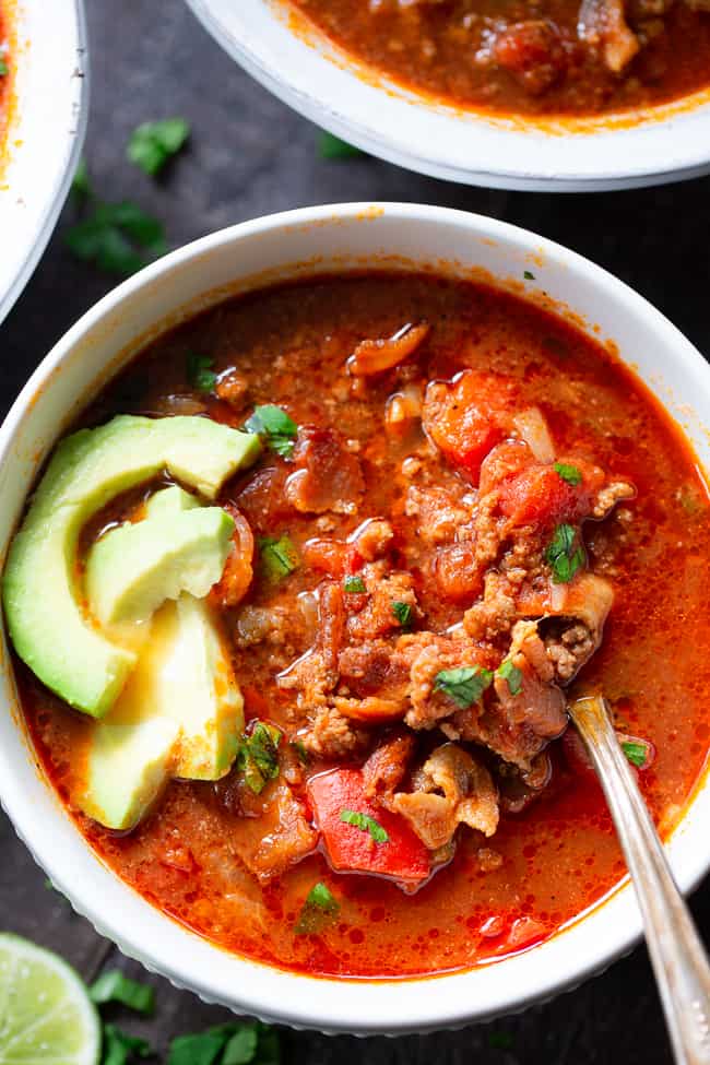 This easy instant pot beef chili is packed with everything you’re craving!  Savory ground beef and bacon, peppers, onions and garlic and the perfect spices.  It’s paleo, dairy-free, Whole30 compliant and keto friendly, delicious and family approved! Paleo dinner. Paleo recipes. Whole30 dinner. Whole30 chili. Keto recipes.