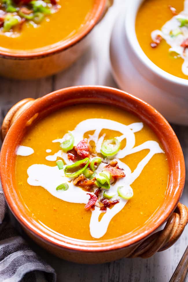 This Paleo and Whole30 butternut squash soup is creamy, sweet and savory!  It’s made simple and fast in the Instant Pot for a quick healthy comforting meal. Bacon and apples lend sweet and smoky flavor to this fall and winter family favorite.  Paleo soup.  Paleo dinner.  Paleo instant pot.