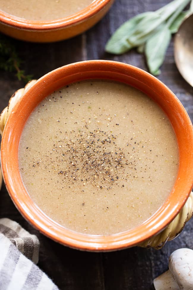 This Paleo Cream of Mushroom Soup is savory and comforting on its own and perfect as a base for so many recipes!  It's simple, fast, and flavorful.  This dairy-free and Whole30 compliant soup is a comforting fall and winter staple.