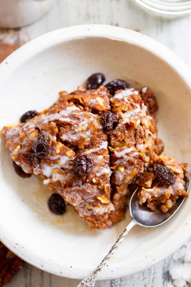 This pumpkin "oatmeal" bake is totally grain free yet tastes just like classic baked oatmeal.  It's packed with pumpkin and pumpkin pie spices, and pure maple syrup adds just the right amount of sweetness.  It reheats perfectly, making it a great fall comfort food breakfast when you're on the go!  Paleo, dairy-free, egg free, and vegan.