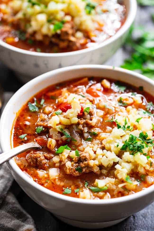 This stuffed pepper soup is loaded with everything you’re craving!  Italian spices, savory ground beef, garlic and onions, bell peppers, and cauliflower “rice” make this a hearty soup that’s also super healthy for you.  Gluten-free, dairy-free, keto and Whole30 friendly.