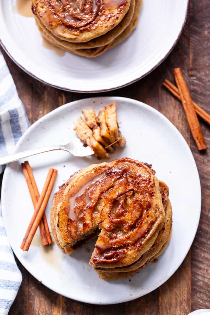 These grain free and paleo cinnamon roll pancakes have a gooey cinnamon swirl and maple glaze for the best of all things cinnamon roll without the work!   Family approved, gluten-free, with a dairy-free option. Paleo breakfast.  Gluten-free pancakes.  Paleo pancakes.  Paleo Christmas recipes.  Paleo Christmas.