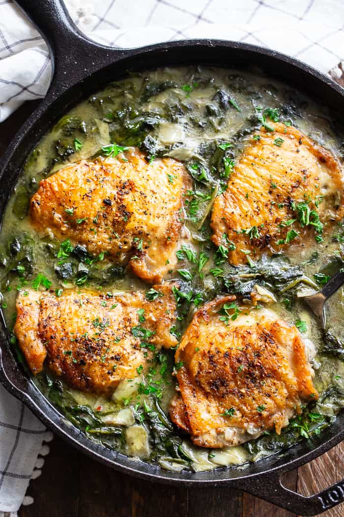 This spinach artichoke chicken is crispy, creamy, and packed with flavor!  It’s Paleo, Whole30 compliant,keto friendly, dairy free, and made all in one skillet.  Great served alone or over cauliflower rice! Paleo dinner. Whole30 dinner. One pan dinner.