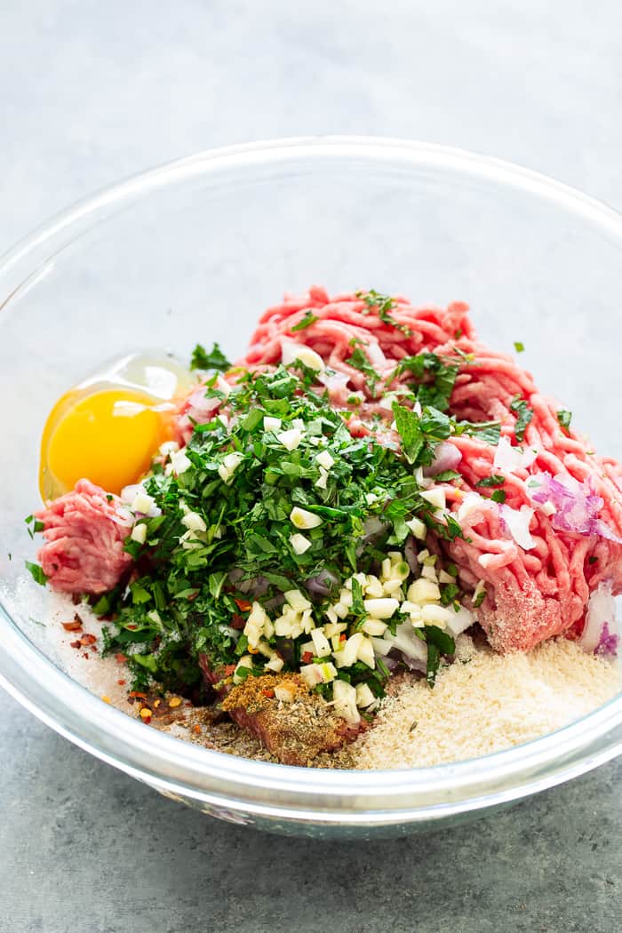 These easy greek meatballs are perfectly flavorful and delicious dipped in a dairy-free paleo Tzatziki sauce!   Great as an appetizer or as part of a meal over a greek salad.  Paleo, Whole30, and keto friendly.