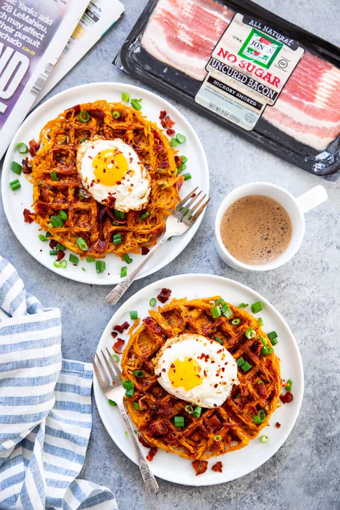 These savory bacon and sweet potato waffles are crisp on the outside, packed with tons of flavor and a fun weekend breakfast or brunch!  Top them with fried eggs and more crispy bacon for a super tasty, filling, wholesome meal that you’ll want to make again and again!  Paleo and Whole30 friendly. #AD @JonesDairyFarm #JonesDairyFarm