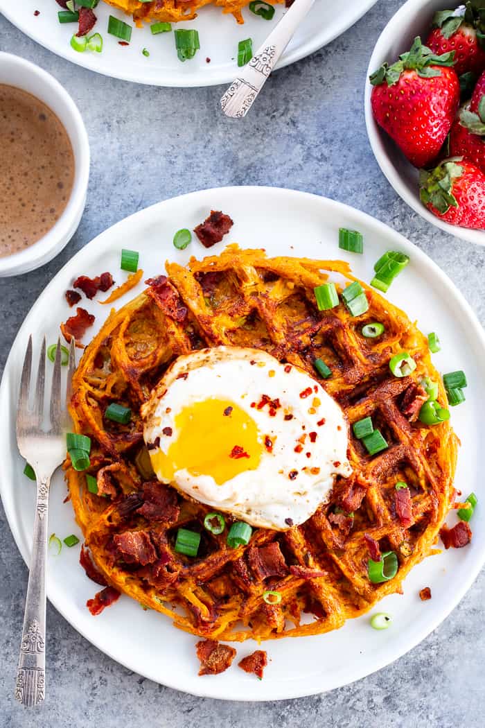 These savory bacon and sweet potato waffles are crisp on the outside, packed with tons of flavor and a fun weekend breakfast or brunch!  Top them with fried eggs and more crispy bacon for a super tasty, filling, wholesome meal that you’ll want to make again and again!  Paleo and Whole30 friendly. #AD @JonesDairyFarm #JonesDairyFarm