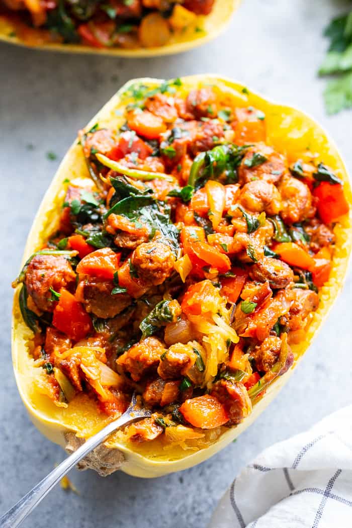 These Instant Pot Spaghetti Squash Boats are loaded with all the yummy things! Sugar free, antibiotic free turkey sausage, onions, peppers, garlic, spinach and marinara make this a healthy, filling dinner that’s paleo, Whole30 compliant and keto friendly too!  #AD @jonesdairyfarm #JonesDairyFarm 