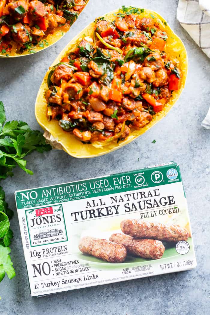 These Instant Pot Spaghetti Squash Boats are loaded with all the yummy things! Sugar free, antibiotic free turkey sausage, onions, peppers, garlic, spinach and marinara make this a healthy, filling dinner that’s paleo, Whole30 compliant and keto friendly too!  #AD @jonesdairyfarm #JonesDairyFarm 