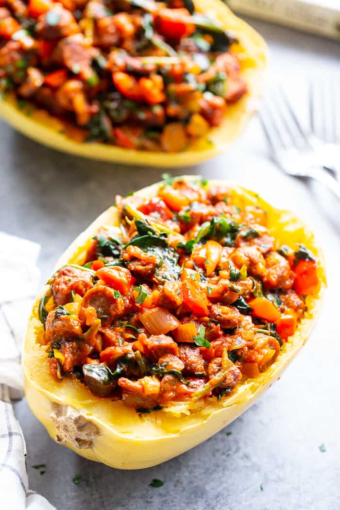 These Instant Pot Spaghetti Squash Boats are loaded with all the yummy things! Sugar free, antibiotic free turkey sausage, onions, peppers, garlic, spinach and marinara make this a healthy, filling dinner that’s paleo, Whole30 compliant and keto friendly too!  #AD @jonesdairyfarm #JonesDairyFarm 