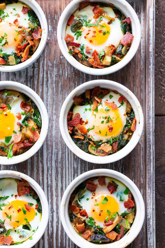 Made in single serving ramekins, these baked eggs are packed with savory goodies and flavor!   Great for weekend brunches and make-ahead friendly for weekdays.  Paleo, Whole30 compliant and keto friendly. 