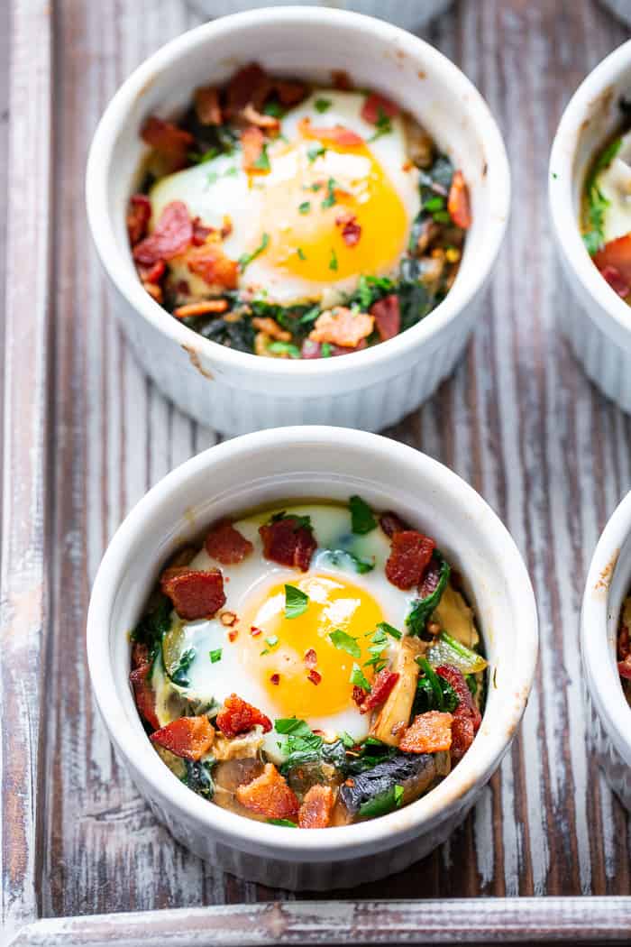 Made in single serving ramekins, these baked eggs are packed with savory goodies and flavor!   Great for weekend brunches and make-ahead friendly for weekdays.  Paleo, Whole30 compliant and keto friendly.