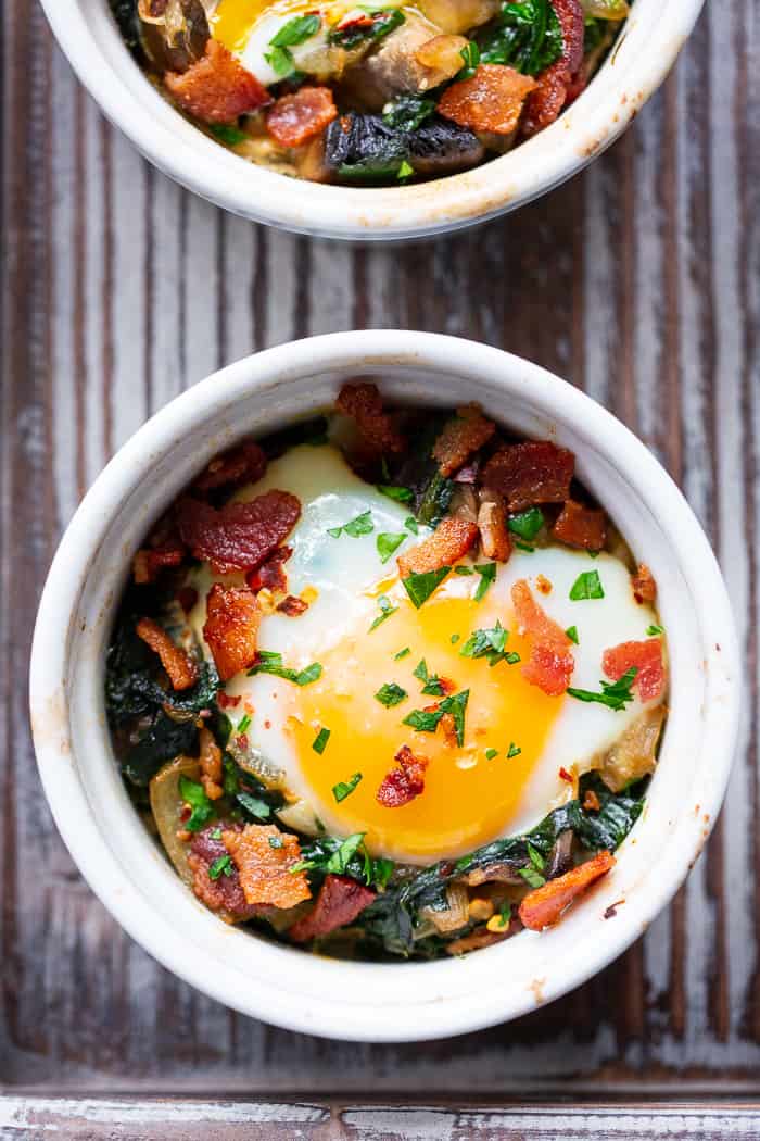 Made in single serving ramekins, these baked eggs are packed with savory goodies and flavor!   Great for weekend brunches and make-ahead friendly for weekdays.  Paleo, Whole30 compliant and keto friendly.